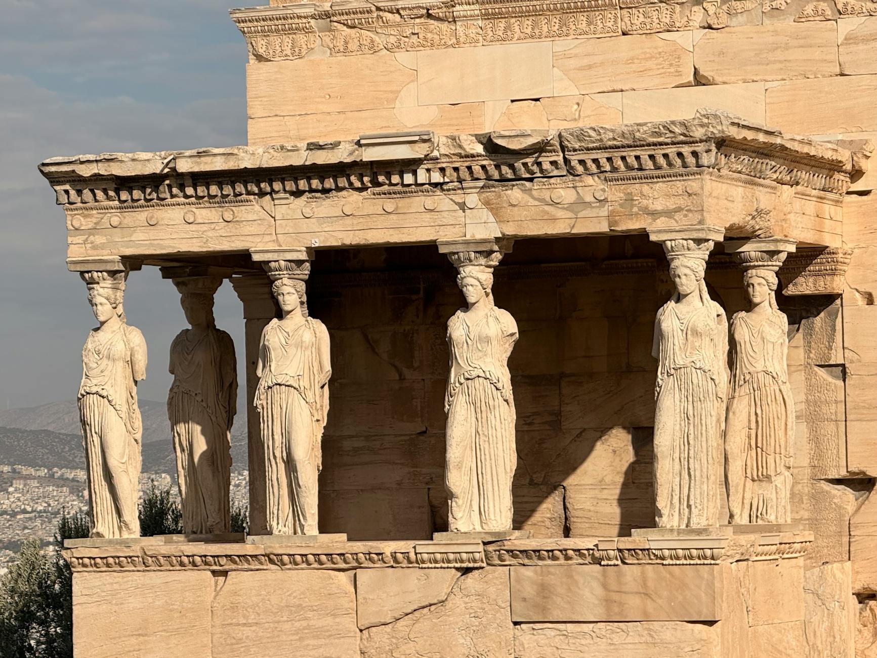 View of the Caryatids on the Erechtheion, Acropolis in Athens under daylight.