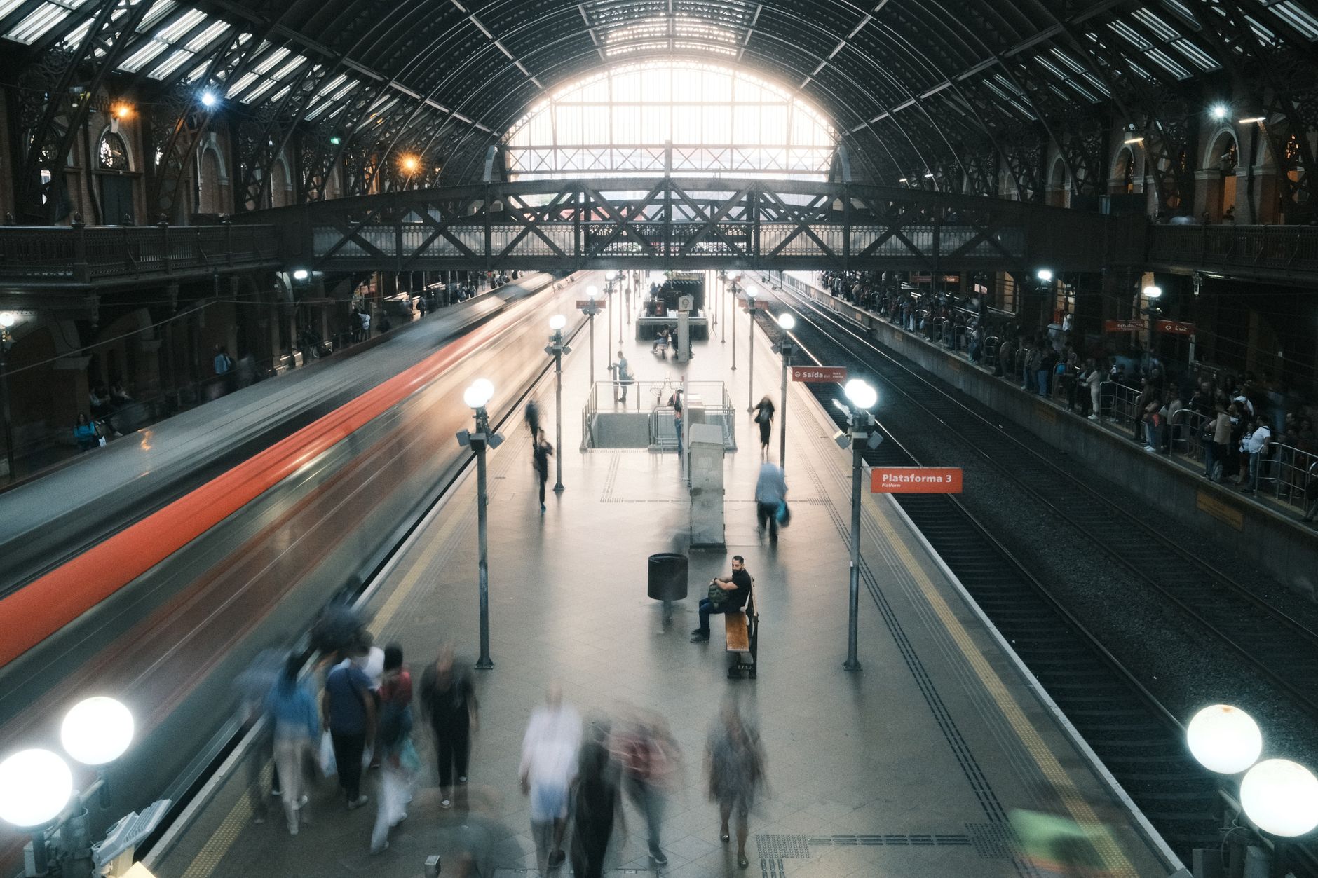 Dynamic city train station with blurred motion capturing urban hustle and movement.